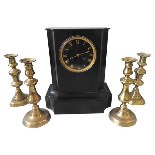 115 - A 19TH CENTURY SLATE MANTEL CLOCK, the case with canted corners, the black dial with brass numerals ... 