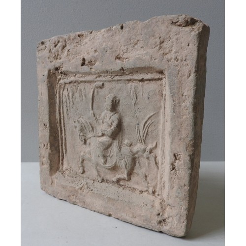 233 - A CHINESE STONE TOMB TILE, the square tile decorated in low relief depicting a polo player on horseb... 