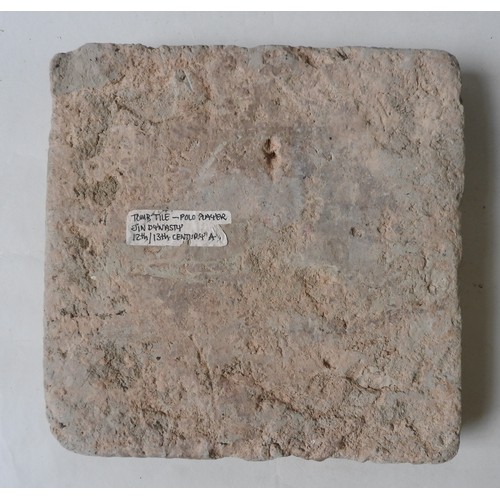 233 - A CHINESE STONE TOMB TILE, the square tile decorated in low relief depicting a polo player on horseb... 