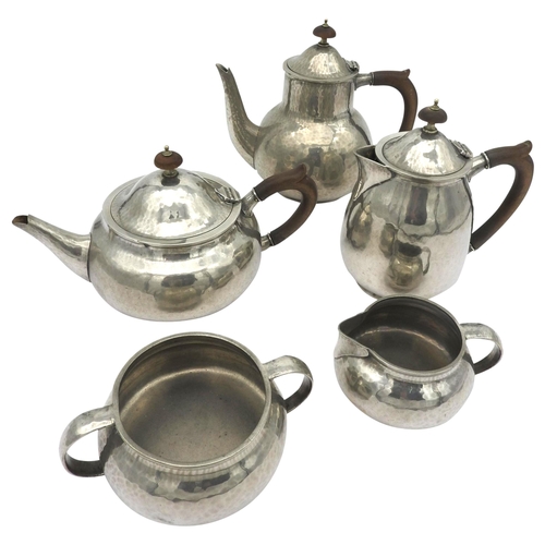 424 - A LIBERTY FIVE PEWTER TEA SET with hammered finish marked 'Made by Liberty & Co English Pewter'.... 