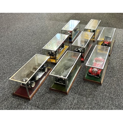 41 - EIGHT PRE-WAR MODEL CARS IN GLASS CASES (1:24)Acquired by our client new in the 1970s, mounted on wo... 