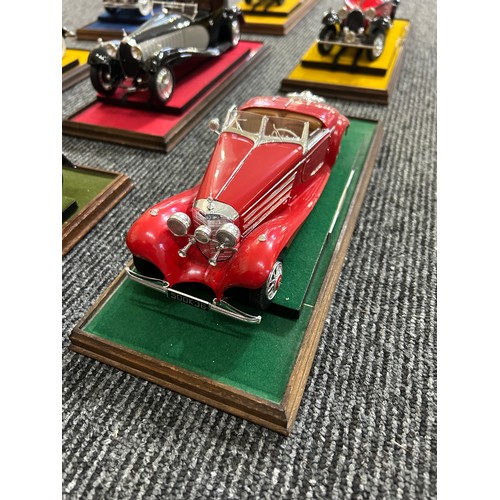 41 - EIGHT PRE-WAR MODEL CARS IN GLASS CASES (1:24)Acquired by our client new in the 1970s, mounted on wo... 