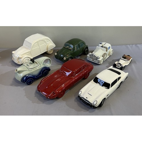 520 - SEVEN CERAMIC MODEL CARSAston Martin DB5 by CVW Designs (31cm). Damage to rear left light area.Jagua... 