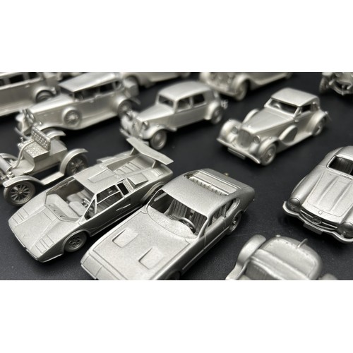 521 - PEWTER MODEL CAR AND AEROPLANE COLLECTION A collection of pewter miniature cars and aeroplanes, most... 