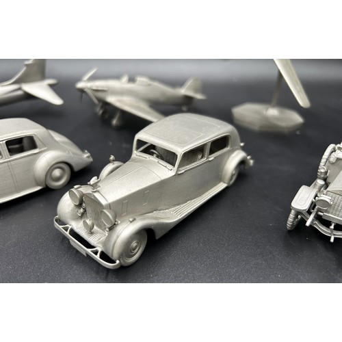 521 - PEWTER MODEL CAR AND AEROPLANE COLLECTION A collection of pewter miniature cars and aeroplanes, most... 