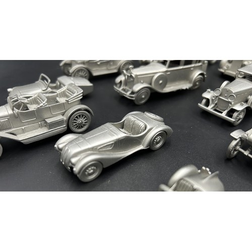 521 - PEWTER MODEL CAR AND AEROPLANE COLLECTION A collection of pewter miniature cars and aeroplanes, most... 