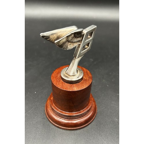 490 - A SMALL SILVER BENTLEY 'FLYING B' MASCOT1950s, silver. A presentation for long service to a former m... 