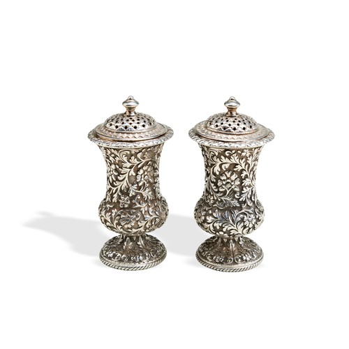 87 - PAIR OF CHASED PEPPERS, KUTCH, C.1860. A pair of heavy gauge and well executed Kutch peppers with gi... 