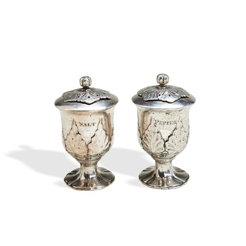 110 - A PAIR OF VASE SHAPE CONDIMENT SHAKERS, CALCUTTA C.1850. A pair of condiment shakers with embossed a... 