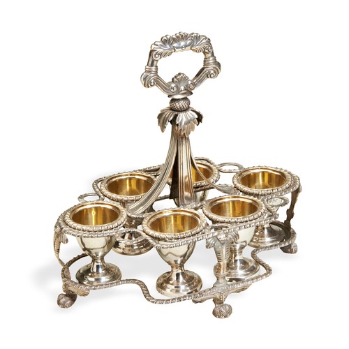 111 - AN ANGLO-INDIAN EGG CRUET WITH SIX EGG CUPS, CALCUTTA C.1830. An egg cruet frame with a cast florate... 