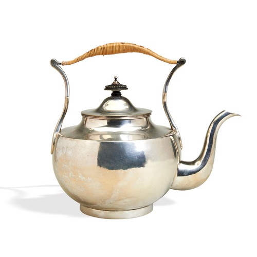 A LARGE MUGHAL FORM TEA KETTLE, MADRAS C.1805. A large plain circular tea kettle with a reeded rim and stained black finial. In Mughal style with a wicker covered handle. Made by Gordon & Lovell of Madras, c.1805.