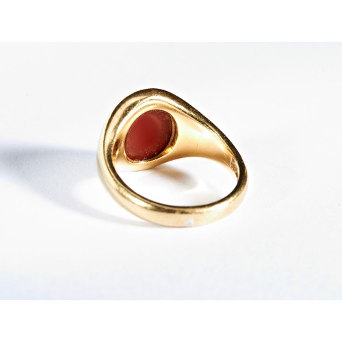 222 - CARNELIAN SIGNET RINGthe oval carnelian plaque set in a gold mountHallmarked for 18 carat goldTotal ... 