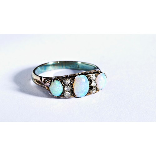 236 - OPAL AND DIAMOND RING, CIRCA 1890set with three oval cabochon-cut opals spaced by pairs of old brill... 