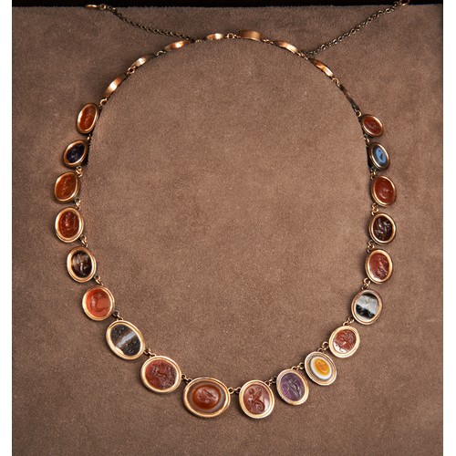 258 - AN IMPORTANT COLLECTION OF ROMAN INTAGLIOS SET WITHIN AN IMPRESSIVE GOLD NECKLACE, ROME, PRE 1870.th... 