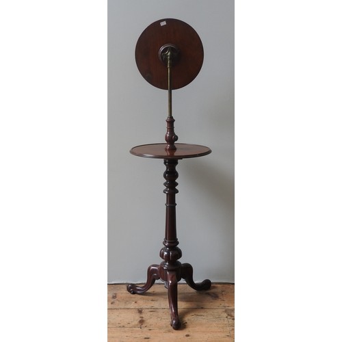 49 - A VICTORIAN MAHOGANY SHAVING STAND, CIRCA 1860,adjustable circular mirror above a circular top, on a... 