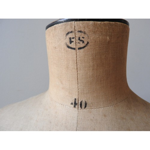 450 - AN EARLY 20TH CENTURY 'STOCKMAN' DRESSMAKER'S MANNEQUIN, the torso with printed manufacturer's mark,... 