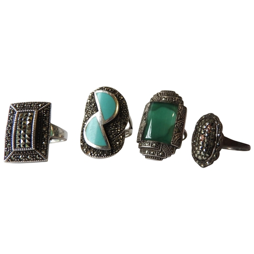 404 - A GROUP OF FOUR VINTAGE ART DECO SILVER RINGS, set with enamel and marciste