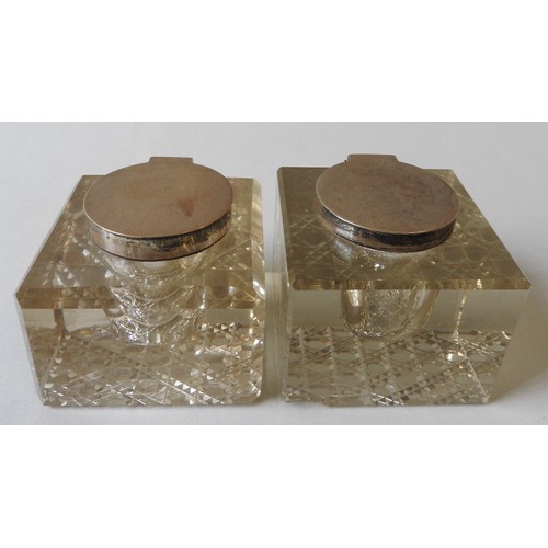 419 - A PAIR OF VINTAGE SILVER MOUNTED CUT GLASS INKWELLS, square form with bevelled edges and hobnail pat... 