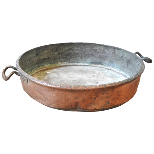 107 - A LARGE 19TH CENTURY COPPER PRESERVING PAN, with twin riveted ring handles (58 cm diam)