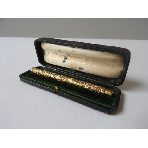 414 - A VINTAGE MABIE TODD 'SWAN' FOUNTAIN PEN, the gold plated body and lid with profuse repousse rocaill... 