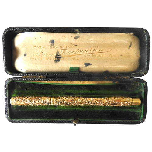 414 - A VINTAGE MABIE TODD 'SWAN' FOUNTAIN PEN, the gold plated body and lid with profuse repousse rocaill... 