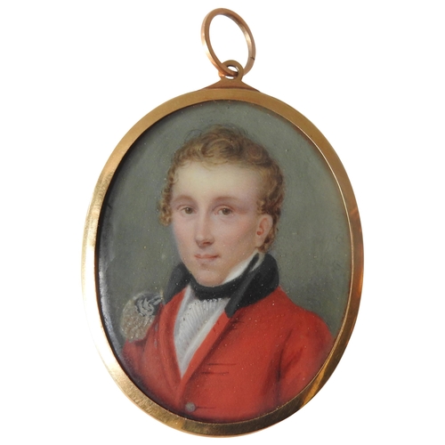 438 - A REGENCY PORTRAIT MINIATURE OF YOUNG GENTLEMAN IN MILITARY JACKET, hand painted on an oval panel, i... 