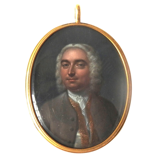 A LATE 18TH CENTURY PORTRAIT MINIATURE OF NOBLEMAN, of a gentleman in wig and frock coat, hand painted on a panel, in a yellow metal mount