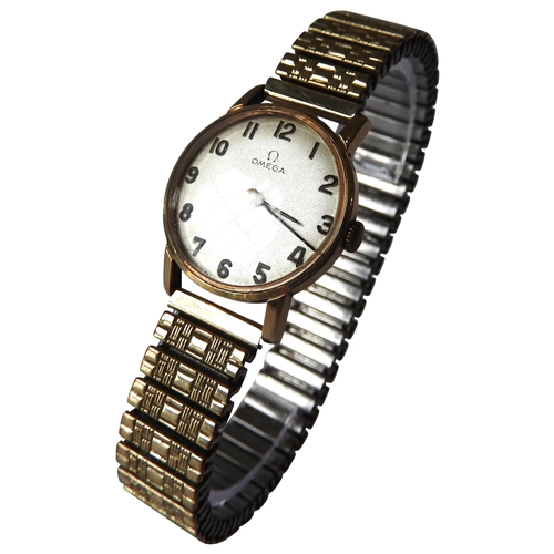 397 - AN OMEGA 9CT GOLD CASED LADIES WRISTWATCH, 20 mm champagne colour inscribed dial with Arabic numeral... 