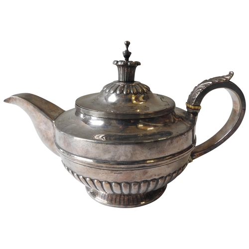 430 - A GEORGE III SILVER TEAPOT, circular tapering form with fluted pattern lower section, chased foliate... 