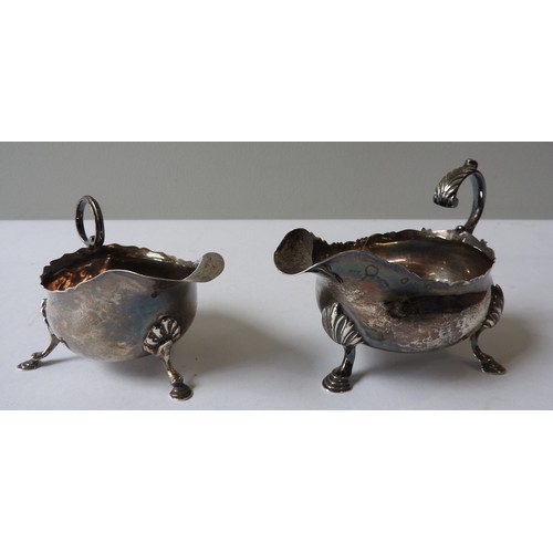 427 - A GEORGE III SILVER SAUCEBOAT AND AN EDWARDIAN SILVER SAUCEBOAT, the George III sauceboat with elega... 