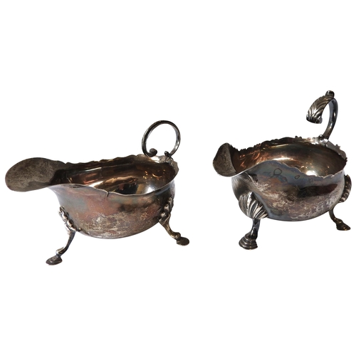 427 - A GEORGE III SILVER SAUCEBOAT AND AN EDWARDIAN SILVER SAUCEBOAT, the George III sauceboat with elega... 