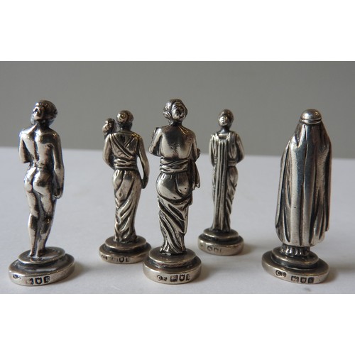 429 - A GROUP OF FIVE MINIATURE EDWARDIAN SILVER FIGURINES, modelled as classical Greco-Roman maidens, rob... 