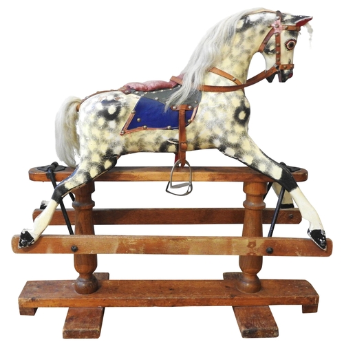 451 - A VINTAGE HAND PAINTED CHILD'S NURSERY ROCKING HORSE, CIRCA 1920, with a cream and black dappled fin... 