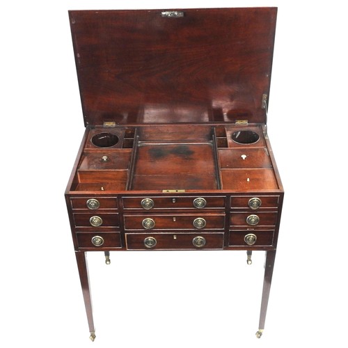 40 - A LATE GEORGIAN MAHOGANY GENTLEMAN'S DRESSING TABLE, the hinged rectangular top opening to reveal an... 