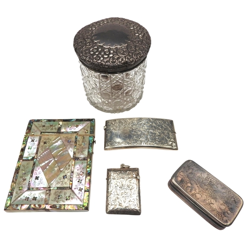 423 - TWO EDWARDIAN SILVER VESTAS, SILVER SNUFF BOX, SILVER TOP JAR AND A MOTHER OF PEARL CARD CASE, the s... 