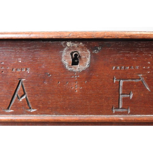 94 - A EARLY 18TH CENTURY OAK COFFER ON STAND, hinged rectangular top above a frieze panel subdivided by ... 