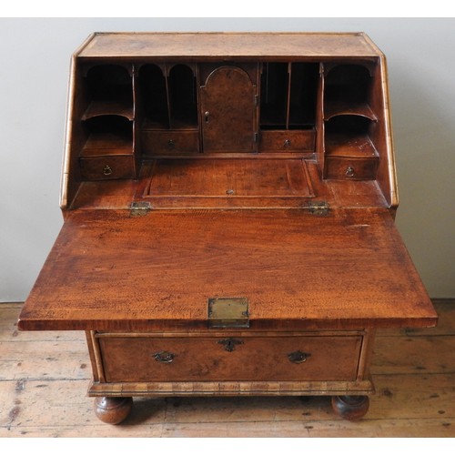 96 - A WALNUT BUREAU, LATE 19TH / EARLY 20TH CENTURY, in the Queen Anne style, feather banded top and fro... 