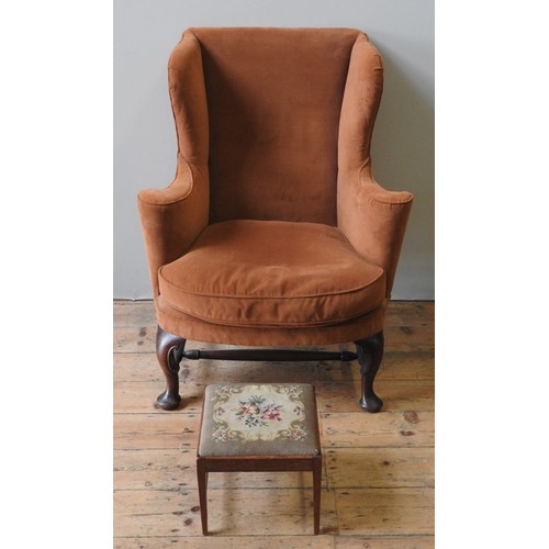 95 - A 19TH CENTURY MAHOGANY FRAMED WING CHAIR, in the Queen Anne style, with elegant scrolling arm suppo... 