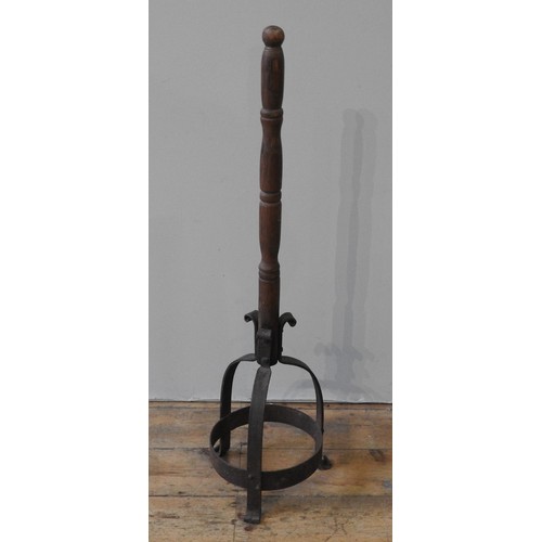 67 - AN UNUSUAL EARLY 19TH CENTURY CAST-IRON BOOT SCRAPER, comprised of three scrolling bands united by a... 