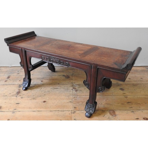 86 - A FINE CHINESE HARDWOOD KANG TABLE, of compact proportions, scroll ended panelled rectangular top ab... 