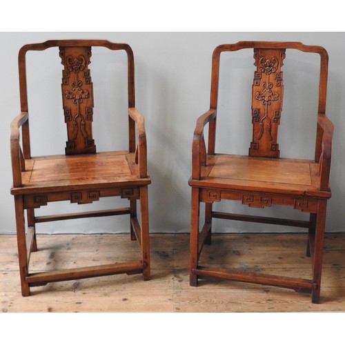 83 - A PAIR OF CHINESE MING-STYLE HARDWOOD CHAIRS, yokeback form with carved slightly curving splats, the... 