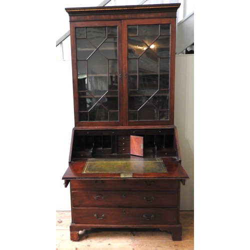 456 - AN EARLY 19TH CENTURY MAHOGANY BUREAU BOOKCASE, the top section comprised of a dentil cornice above ... 