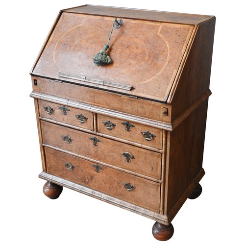 96 - A WALNUT BUREAU, LATE 19TH / EARLY 20TH CENTURY, in the Queen Anne style, feather banded top and fro... 