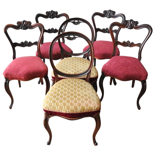 76 - A SET OF FOUR VICTORIAN MAHOGANY BALLOON BACK CHAIRS, ornate floral and scroll carved frames, raised... 