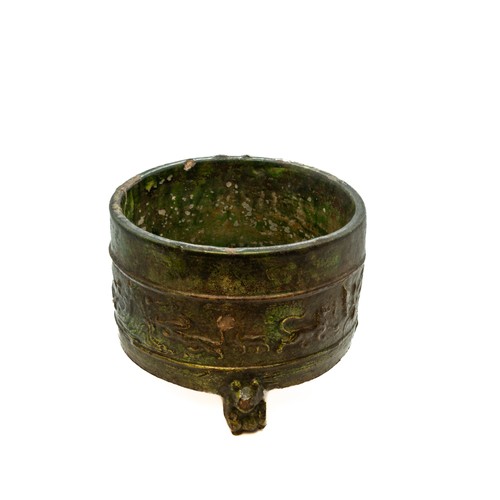 1981 - A CHINESE GREEN-GLAZED ARCHAISTIC TRIPOD CENSERHAN DYNASTY, (206 BC-220 AD)of cylindrical form19cm d... 