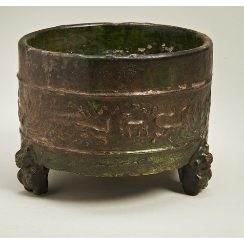 1981 - A CHINESE GREEN-GLAZED ARCHAISTIC TRIPOD CENSERHAN DYNASTY, (206 BC-220 AD)of cylindrical form19cm d... 