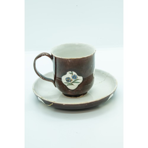 808 - A STAFFORDSHIRE 'BATAVIAN WARE' CUP AND SAUCERCIRCA 1750-60The cup of slight bell shape glazed brown... 