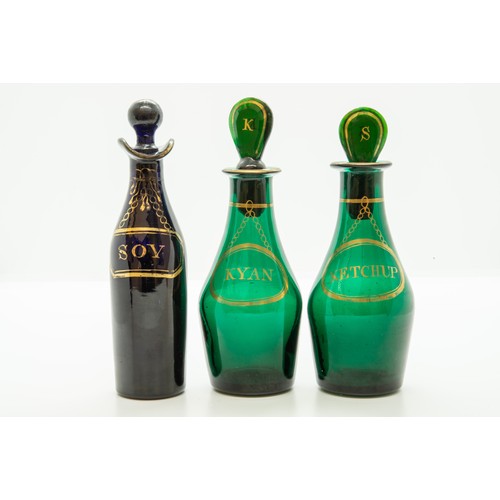 1210 - TWO GREEN GLASS CONDIMENT BOTTLES18TH CENTURYEach with gilded labels, one marked 'KETCHUP', the othe... 