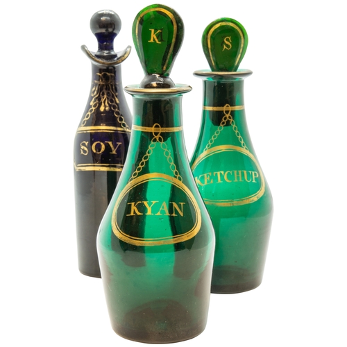 1210 - TWO GREEN GLASS CONDIMENT BOTTLES18TH CENTURYEach with gilded labels, one marked 'KETCHUP', the othe... 