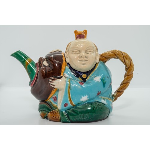845 - A MINTON MAJOLICA TEAPOTCIRCA 1876Modeled as a Japanese actor holding a mask, date code for 1876, 20... 